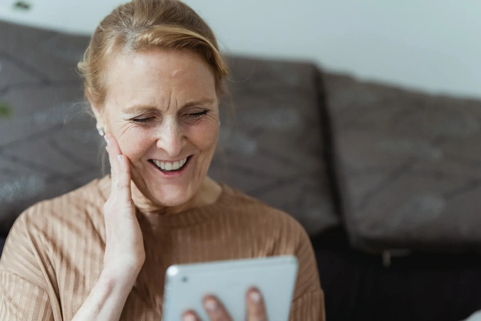 Smiling Woman Using a Tablet